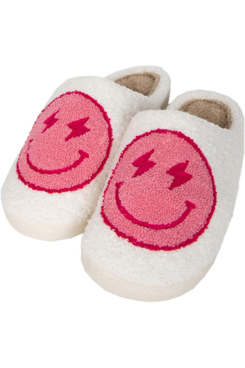 A pair of white slippers with pink lightning smiley faces on them