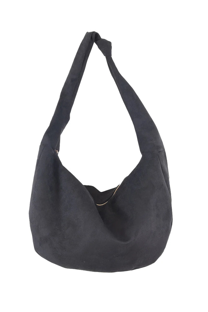 The Katydid Black Spacious Suede Tote Bag is a relaxed hobo shoulder bag for women, featuring a single wide strap and a slouchy shape—perfect as your go-to fall tote.