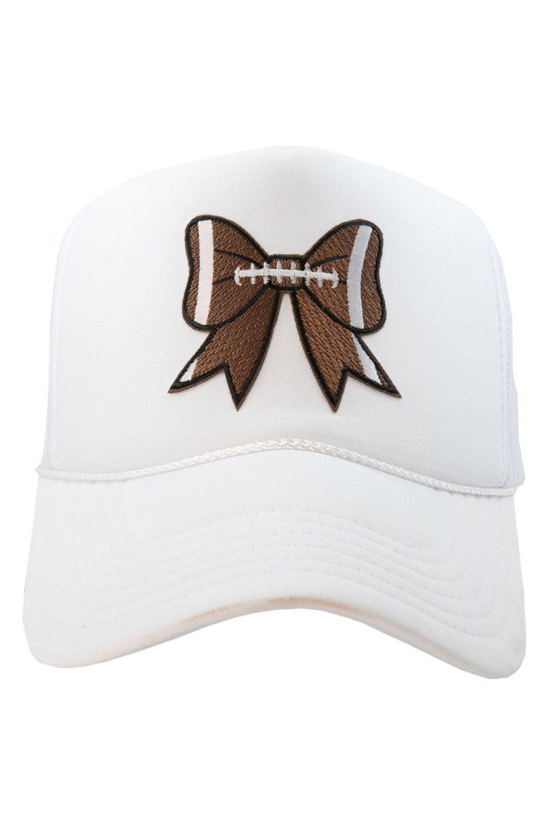 The Katydid Football Bow Coquette Patch Womens Foam Trucker Hat is a white womens hat featuring an embroidered brown football-inspired bow patch with white laces—an ideal accessory for game day.