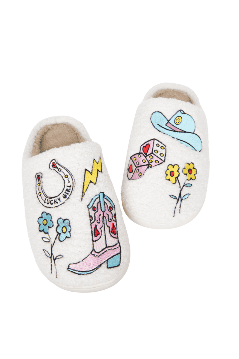 The Katydid Lucky Cowgirl Icons Shoes Slippers feature colorful embroidered designs—cowboy boot, hat, horseshoe, bandana, flowers, and a lightning bolt—making them the perfect cozy Western-inspired slippers for any cowgirl.