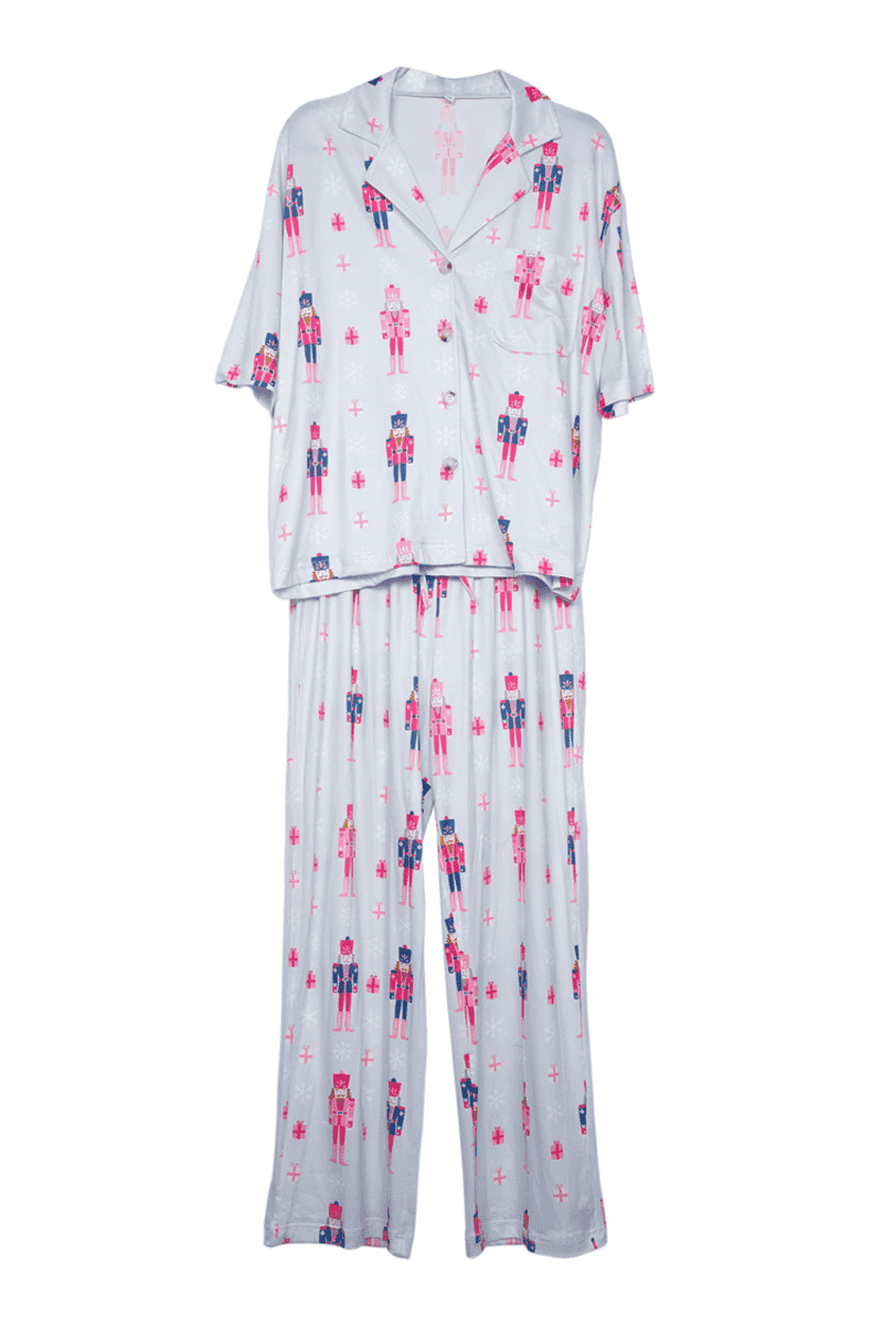 Katydids Nutcrackers Christmas Blue Matching Holiday PJs is a two-piece set with a button-up short-sleeve top and long pants, featuring a festive nutcracker print—ideal for cozy holiday lounging or stylish Christmas pajamas.