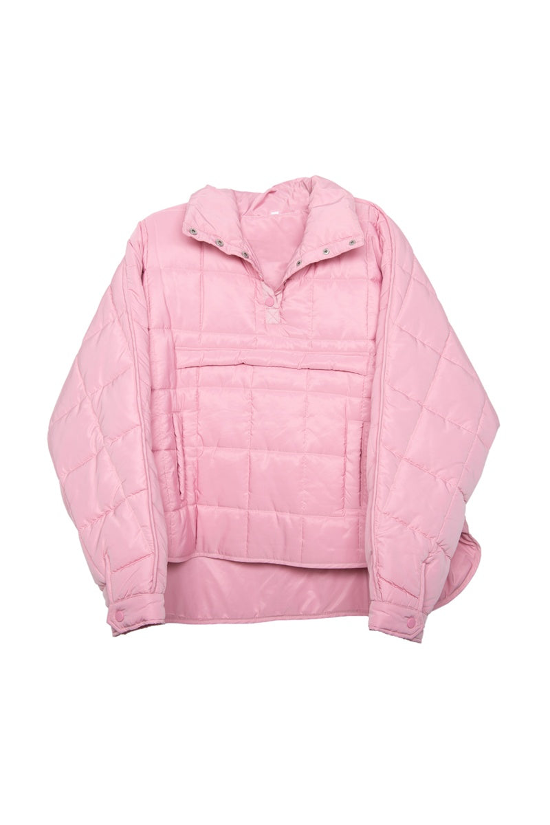 The Katydid Light Pink Puffer Pullover Jacket features a quilted design, high collar, front half-zip, spacious front pocket, long sleeves, and a relaxed fit with a curved hem for effortless style and comfort.