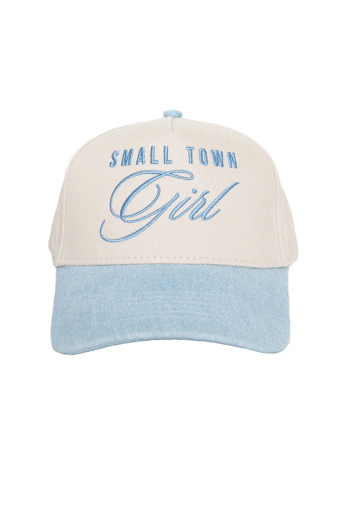 The Katydid Small Town Girl Vintage Trucker Hat for Women features a beige crown, light blue brim, and SMALL TOWN Girl embroidered in blue script—an ideal country-cute accessory.