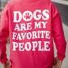 a close-up of the logo on a red “Dogs Are My Favorite People” sweatshirt